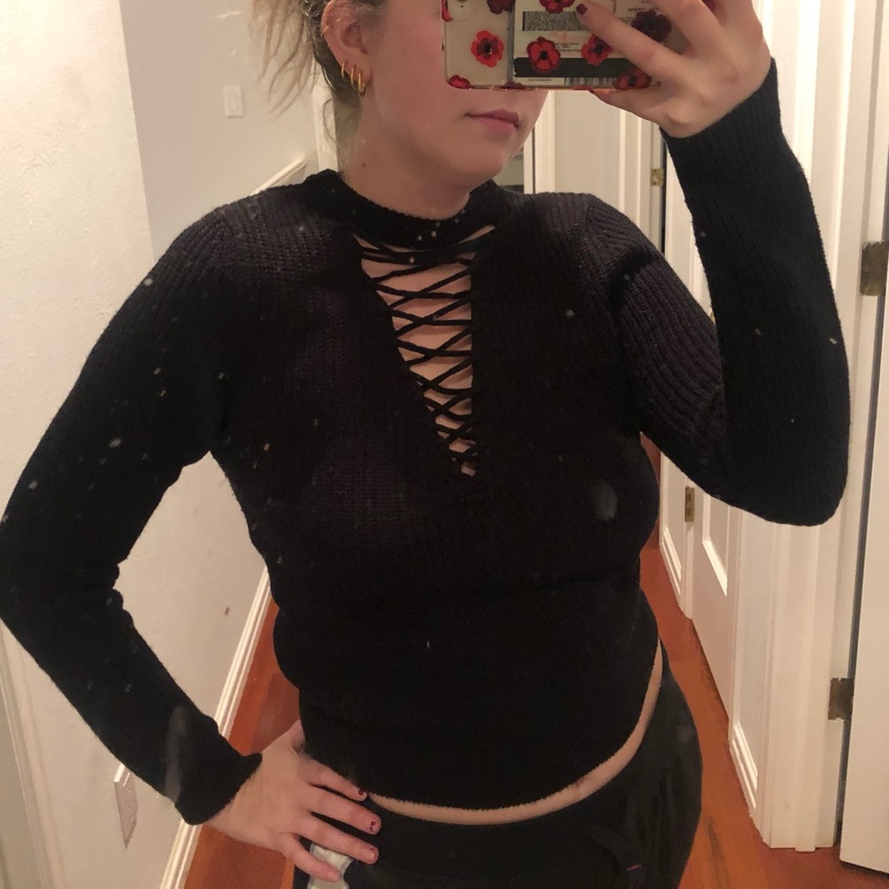 Black tight fitting laced front sweater